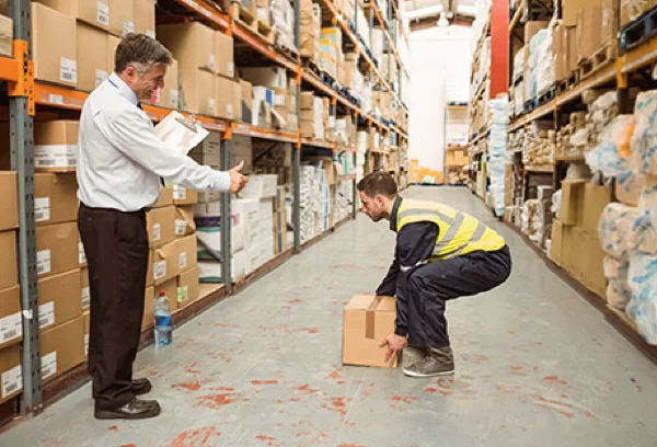 Manual Handling Training Nottingham - Worker demonstrating safe lifting in Nottingham workplace